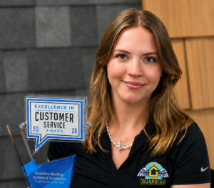 | Guardian Roofing, Gutters & Insulation Guardian Roofing, Gutters & Insulation employee holding their Excellence in Customer Service award